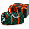Green and black checkerboard barrel bag with orange handles, silver chain and OVWQT branded gift box.
