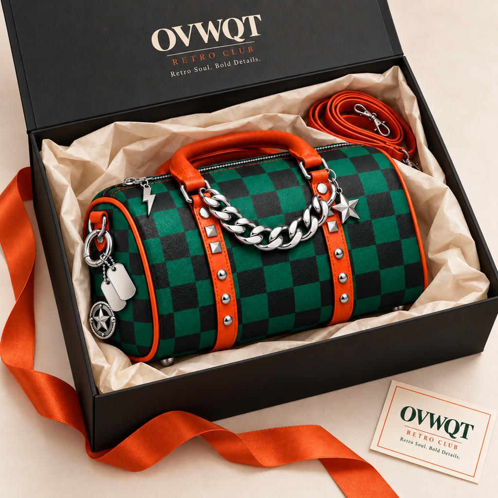 Green checkerboard bag in an open black OVWQT gift box with orange strap, cream tissue and branded gift card.